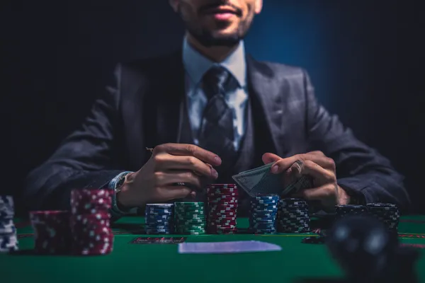 AVIATOR FREE BET Games — Discover modern slots and table adventures A man celebrating a winning moment on his laptop while gaming symbols float around him, capturing the excitement of AVIATOR FREE BET games.